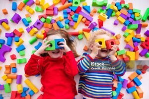 Kids playing with colourful blocks